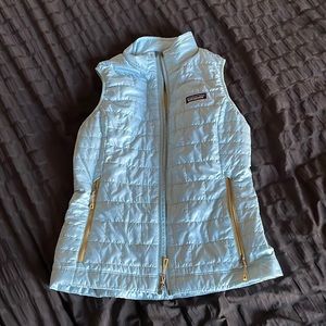 blue and tan patagonia puffy vest